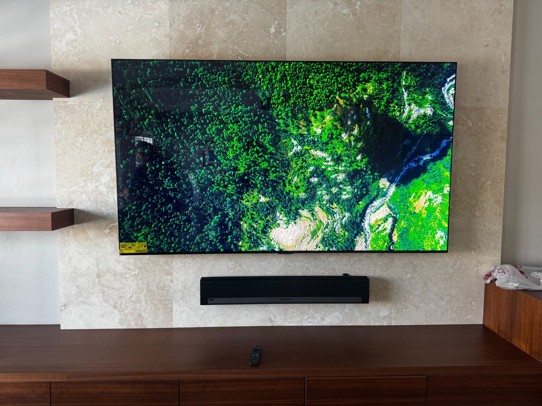 SkyVision TV and Sonos soundbar installation on a stone feature wall